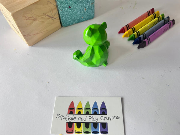 A geometric 3D crayon shaped like a sitting teddy bear