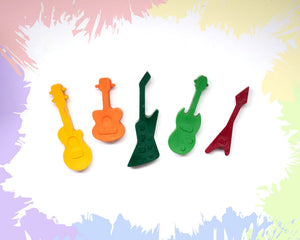 5 small crayons shaped like different styles of guitars