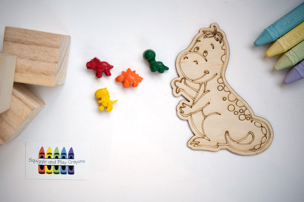 4 small cartoon dinosaur crayons with a large wooden laser-engraved cartoon standing t-rex